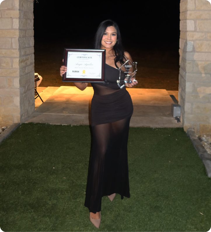 Angie Aguilar holding an award