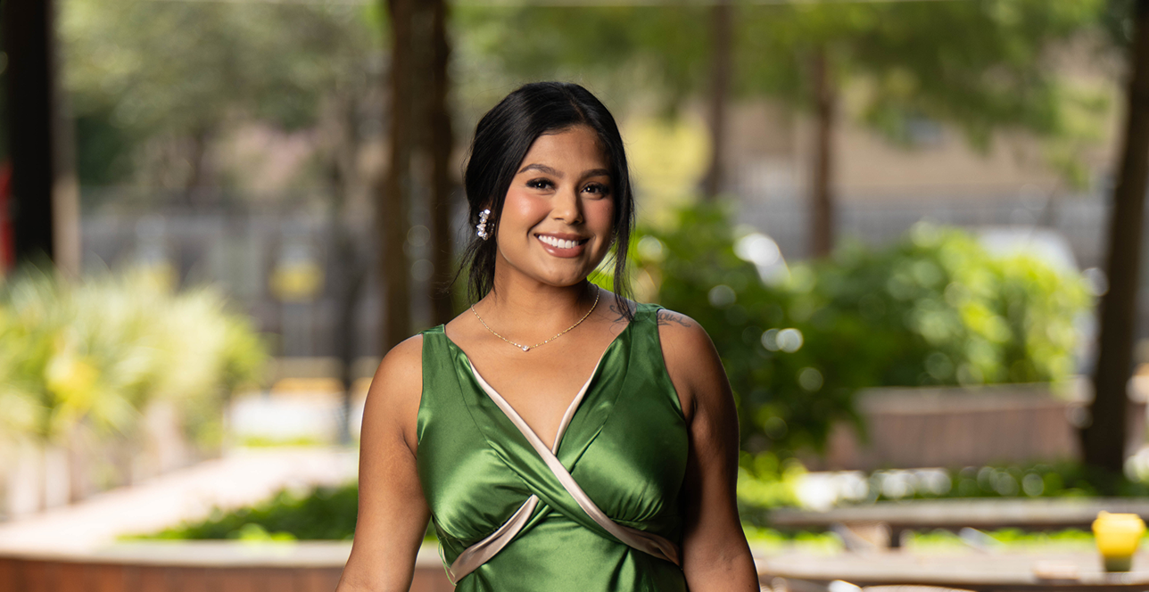 Angie Aguilar in a green top outdoors