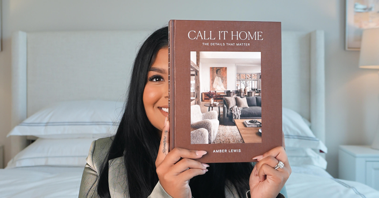 Angie Aguilar holding a Call It Home book