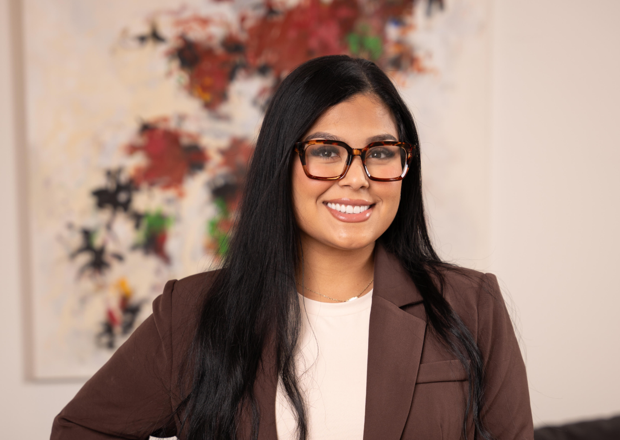 Angie Aguilar in a brown blazer