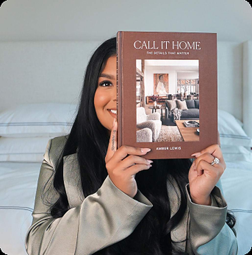 Angie Aguilar holding a Call It Home book