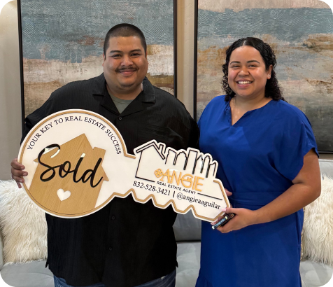 Two clients holding a Sold key